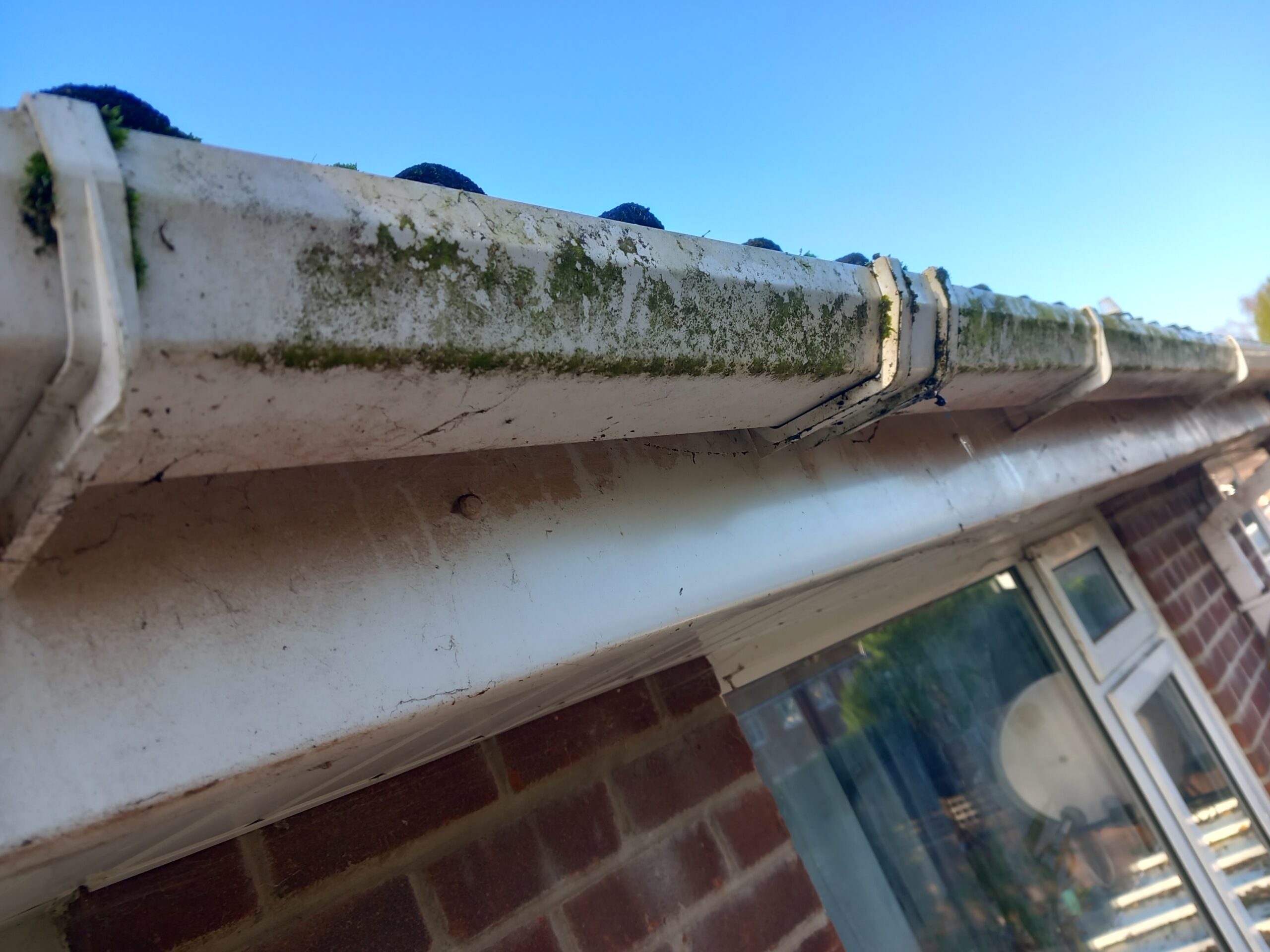 Dirty fascia boards before exterior cleaning