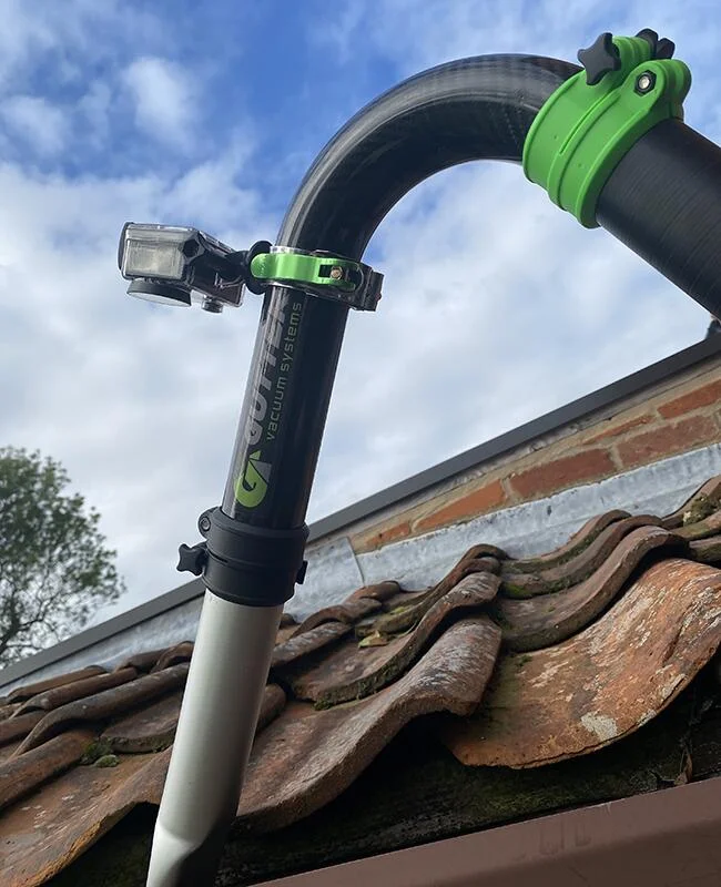 Camera inspection inside a gutter during professional gutter cleaning in Altrincham